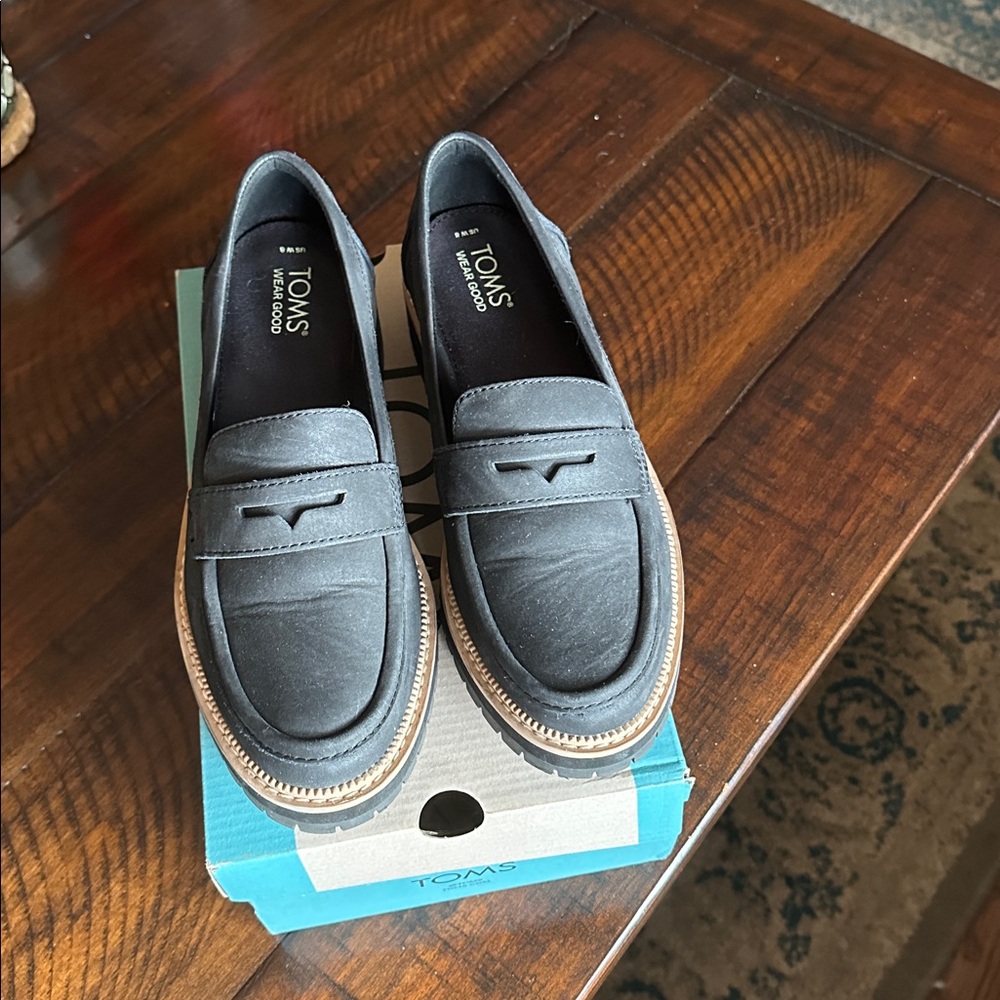 Toms Black Leather Penny Loafers with Tan Trim